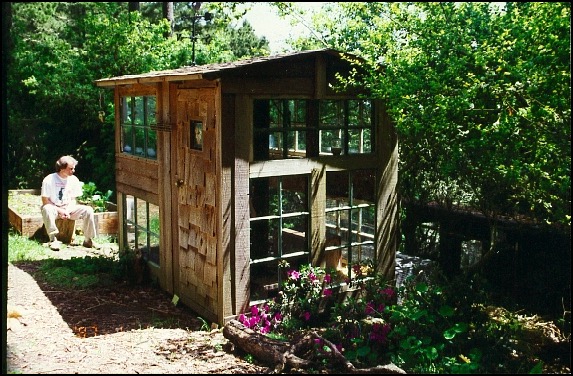 Cottage for rabbits with man playing guitar